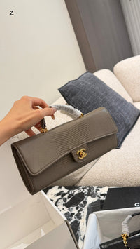 26A Lizard Embossed Top Handle Clutch
