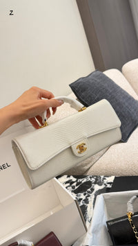 26A Lizard Embossed Top Handle Clutch