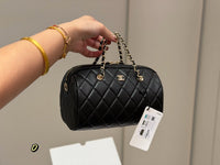 Quilted Barrel Clutch