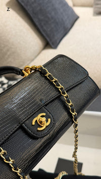 26A Lizard Embossed Top Handle Clutch