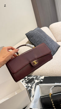26A Lizard Embossed Top Handle Clutch
