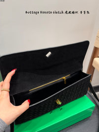 Andiamo Intrecciato Suede Clutch